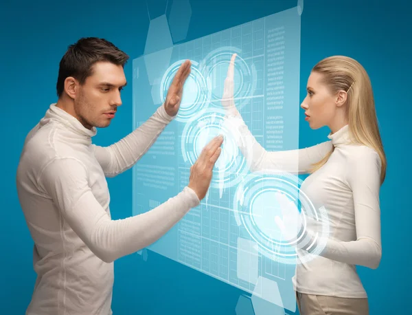 Man and woman working with virtual screens — Stock Photo, Image