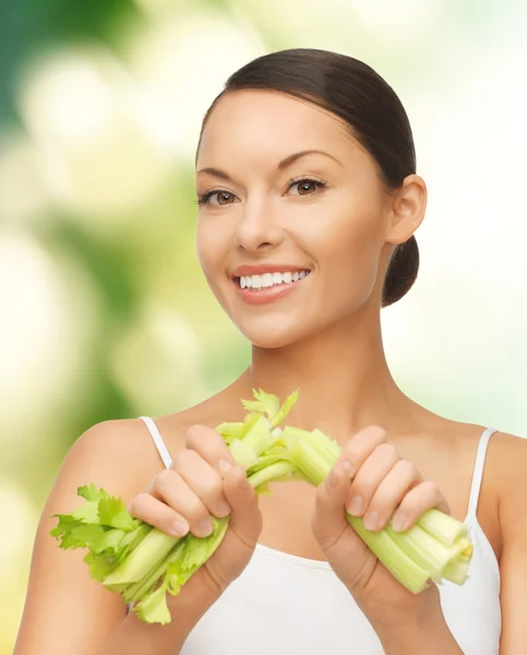 Woman with fresh celery — Stock Photo, Image