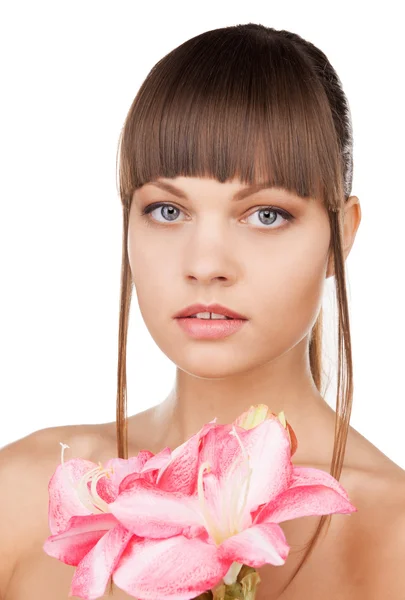 Lovely woman with lily flower — Stock Photo, Image