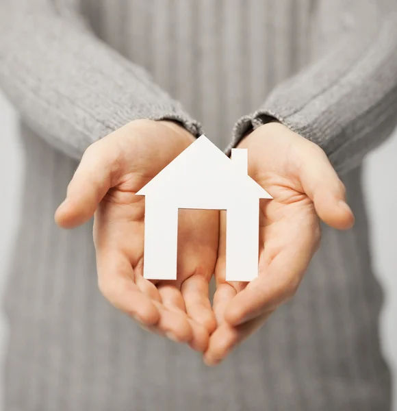 Man holding paper house — Stock Image Man holding paper house Royalty Free Stock Images