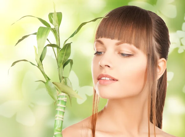 Woman with sprout and butterflies — Stock Photo, Image