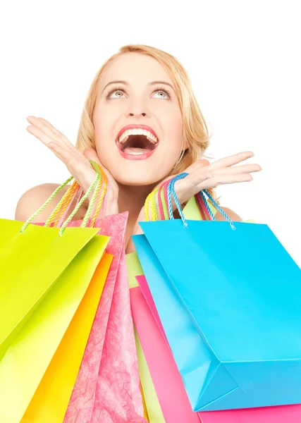 Mujer feliz con bolsas de compras —  Fotos de Stock