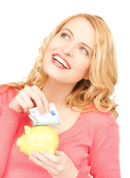 Woman with piggy bank and cash money — Stock Photo, Image