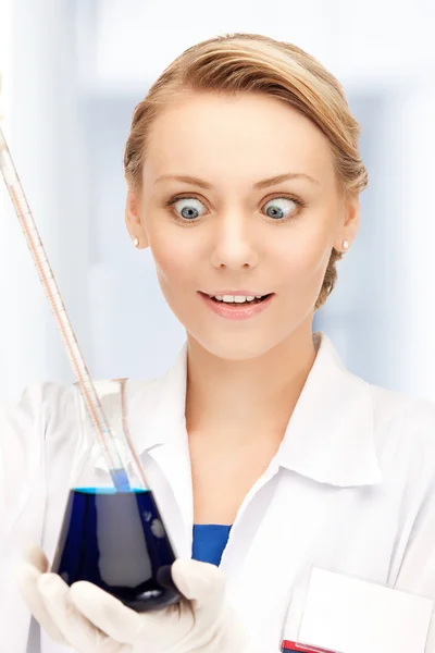 Lab worker holding up test tube — Stock Photo, Image