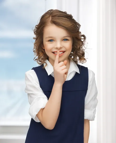 Pre-teen girl showing hush gesture — Stock Photo, Image