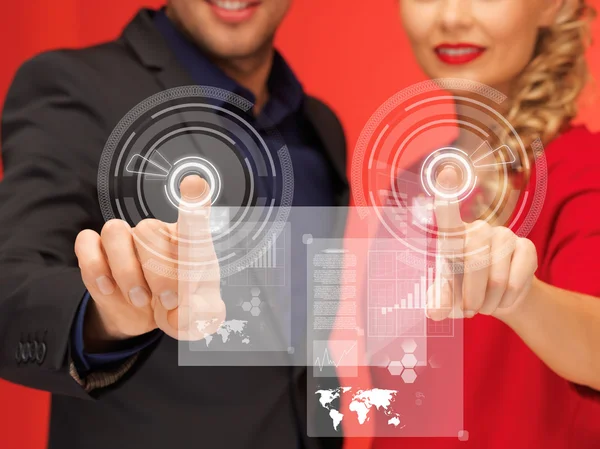 Man and woman pressing virtual button — Stock Photo, Image