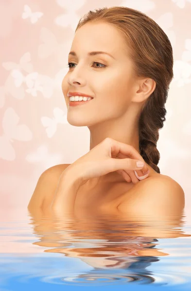 Beautiful woman with butterflies in water Royalty Free Stock Images