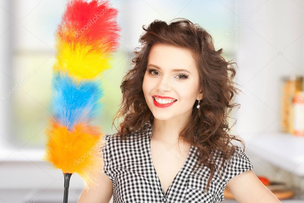 Beautiful woman with cleaning sweep — Stock Photo © Syda_Productions