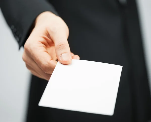 Man in suit holding credit card — Stock Photo, Image