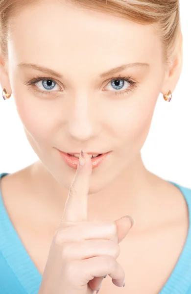 Frau mit Finger auf den Lippen — Stockfoto