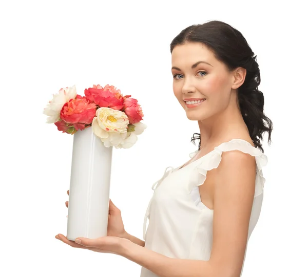 Mujer con jarrón de flores — Foto de Stock