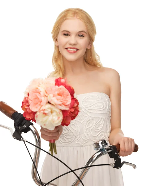 Country girl with bicycle and flowers — Stock Photo, Image