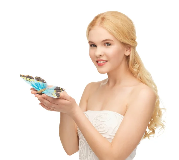 Woman with butterfly in hand — Stock Photo, Image