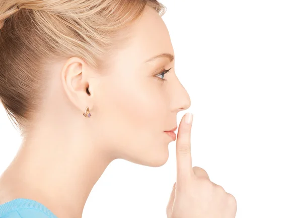 Woman with finger on her lips — Stock Photo, Image