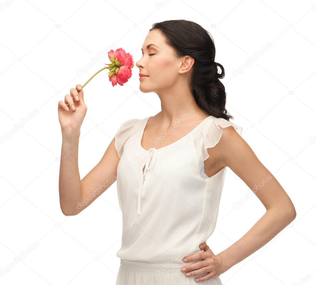 Smelling Young and beautiful woman smelling flower — Stock Photo © Syda_Productions  #22526419