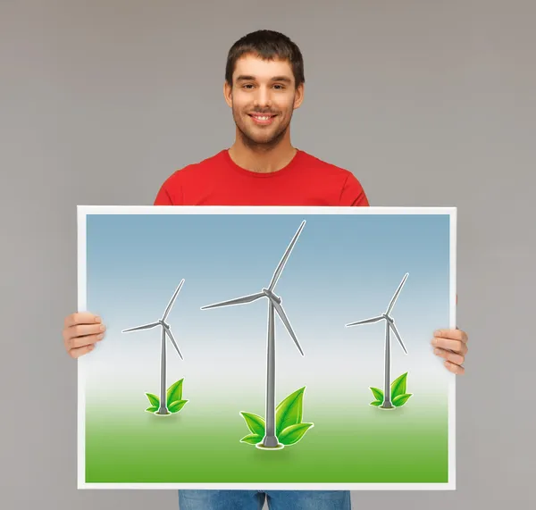 Man met foto van windturbines — Stockfoto