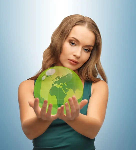 Woman holding green globe on her hands — Stock Photo, Image