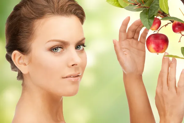 Lovely woman with apple twig Royalty Free Stock Photos