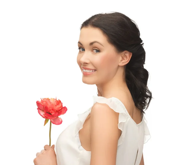 Jonge en mooie vrouw met bloem Stockfoto