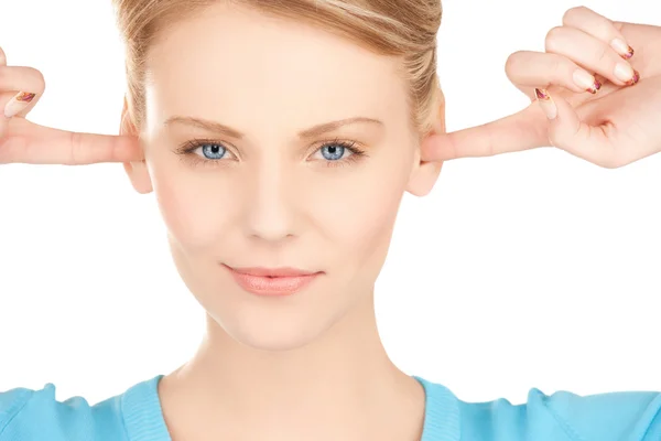 Kvinna stänga öronen med fingrar — Stockfoto