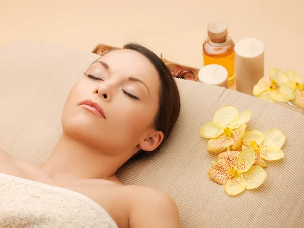 Woman in spa salon lying on the massage desk — Stock Photo, Image