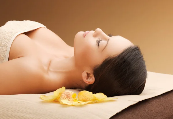 Woman in spa salon lying on the massage desk — Stock Photo, Image