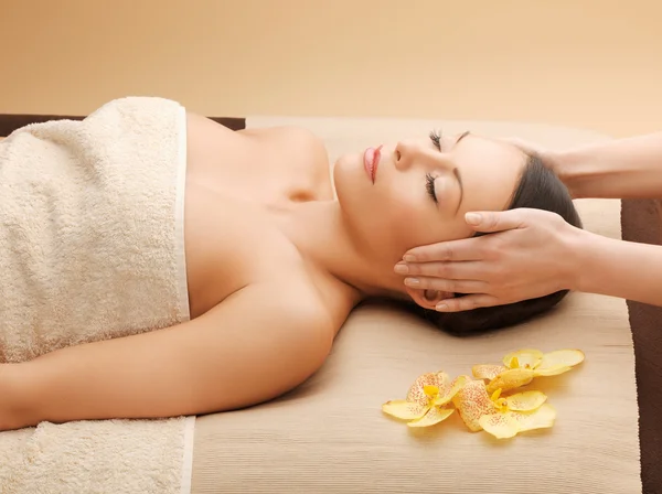 Woman in spa salon lying on the massage desk Stock Photo