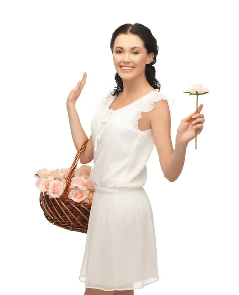 Woman with basket full of flowers — Stock Photo, Image