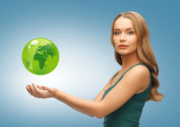 Woman holding green globe on her hands — Stock Photo, Image