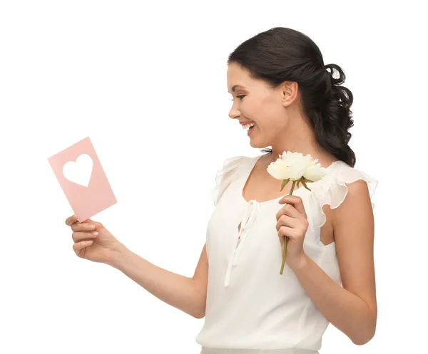 Young woman holding flower and postcard — Stock Photo, Image