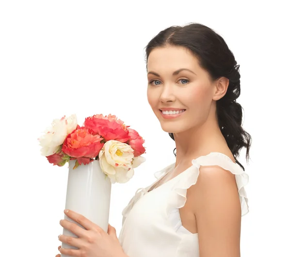 Femme avec vase de fleurs — Photo