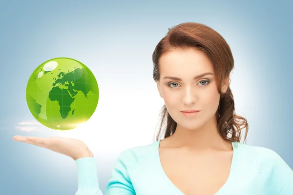 Woman holding green globe on her hand — Stock Photo, Image