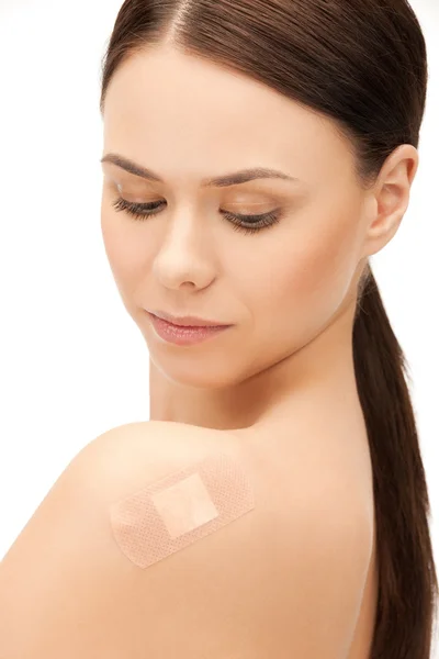 Beautiful woman with medical patch or plaster — Stock Photo, Image