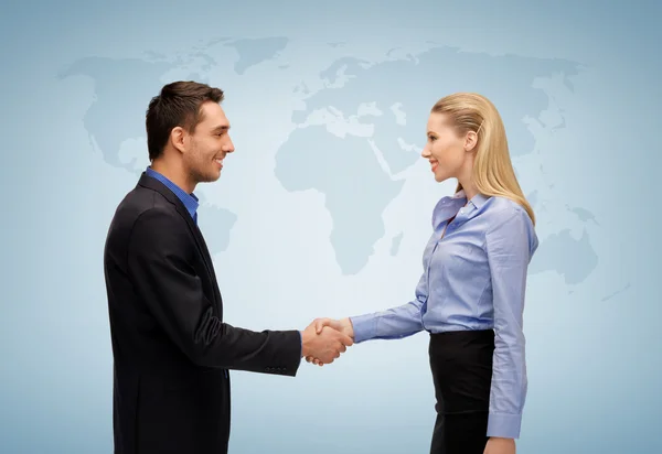 Woman and man shaking hands — Stock Photo, Image