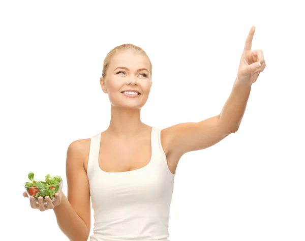 Healthy woman holding bowl with salad — Stock Photo, Image