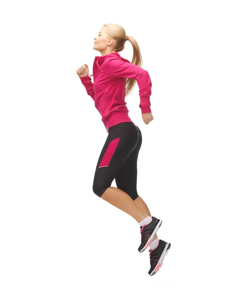 Donna sportiva che corre o salta — Foto Stock