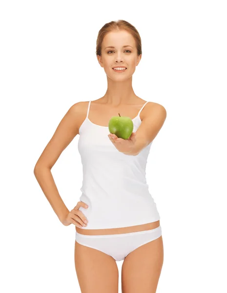 Woman in white underwear holding green apple — Stock Photo, Image