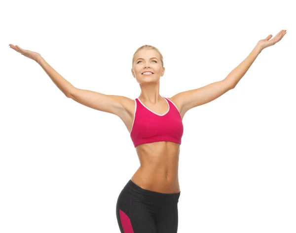 Sportswoman with raised up hands — Stock Photo, Image