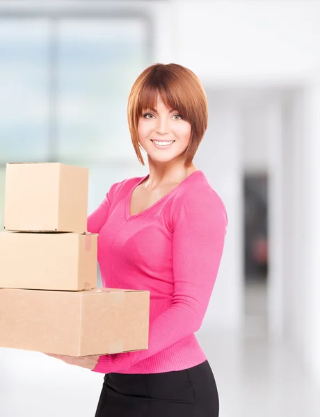Businesswoman with parcels — Stock Photo, Image