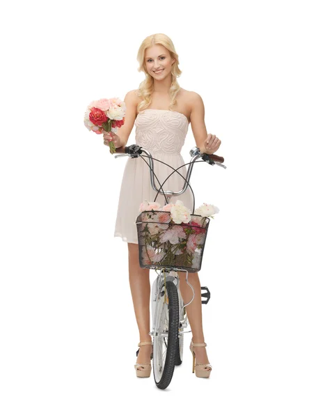 Country girl with bicycle and flowers Royalty Free Stock Images
