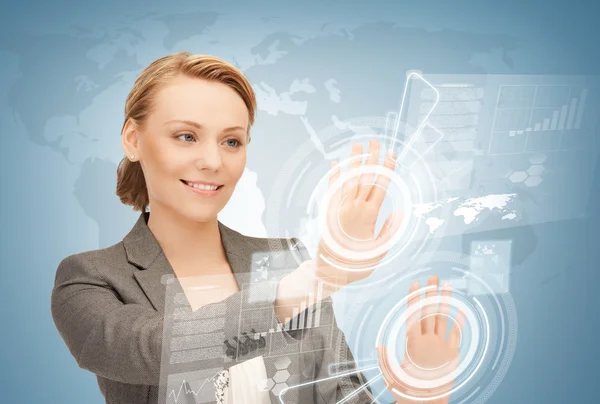 Businesswoman touching virtual screen — Stock Photo, Image