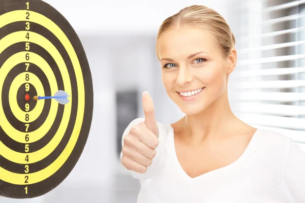 Businesswoman with dart and target — Stock Photo, Image