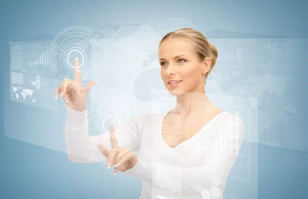 Businesswoman touching virtual screen — Stock Photo, Image