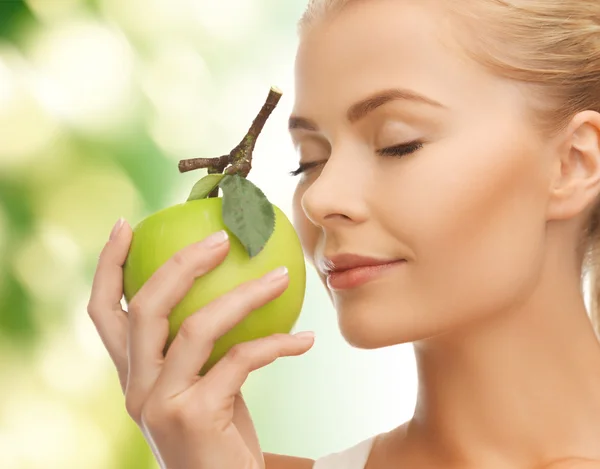 Woman smelling apple — Stock Photo, Image