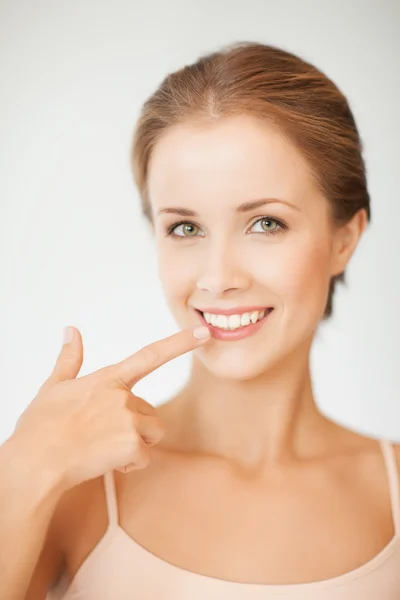 Woman showing her teeth — Stock Photo, Image