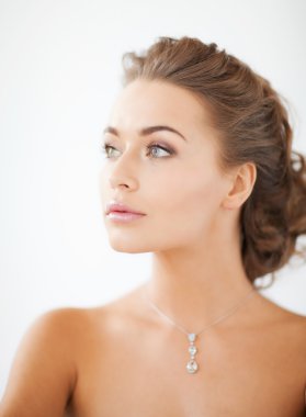 Woman wearing shiny diamond necklace clipart