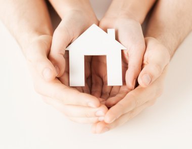 Woman and hands with paper house clipart