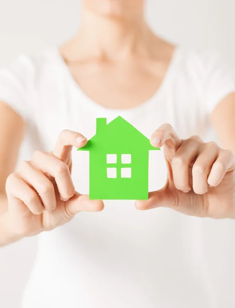 Woman hands holding green house — Stock Photo, Image