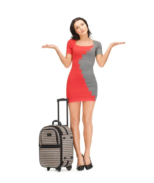 Doubting woman with suitcase — Stock Photo, Image