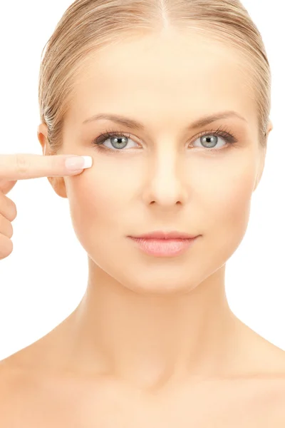 Beautiful woman touching her eye area Stock Image